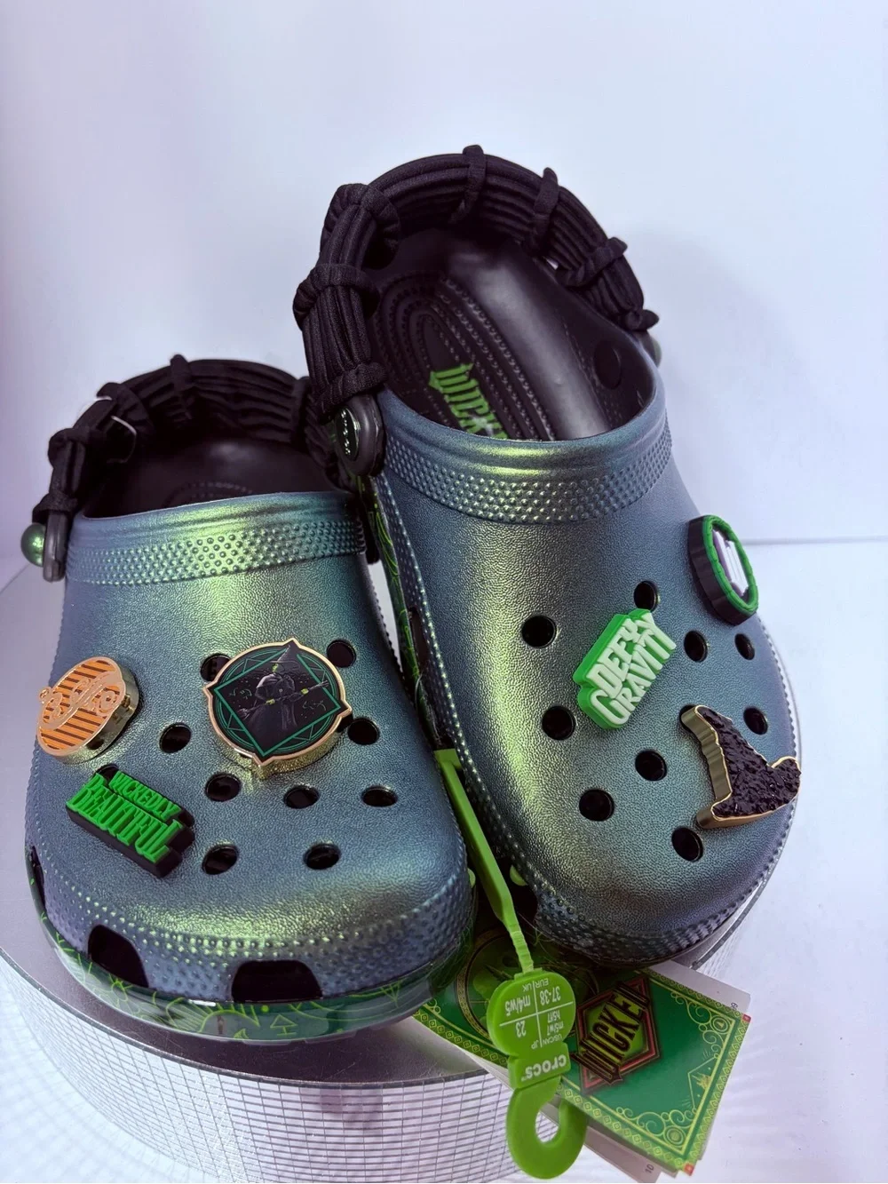 CROCS Kids Iridescent Green Holographic Clogs with Charm Accents